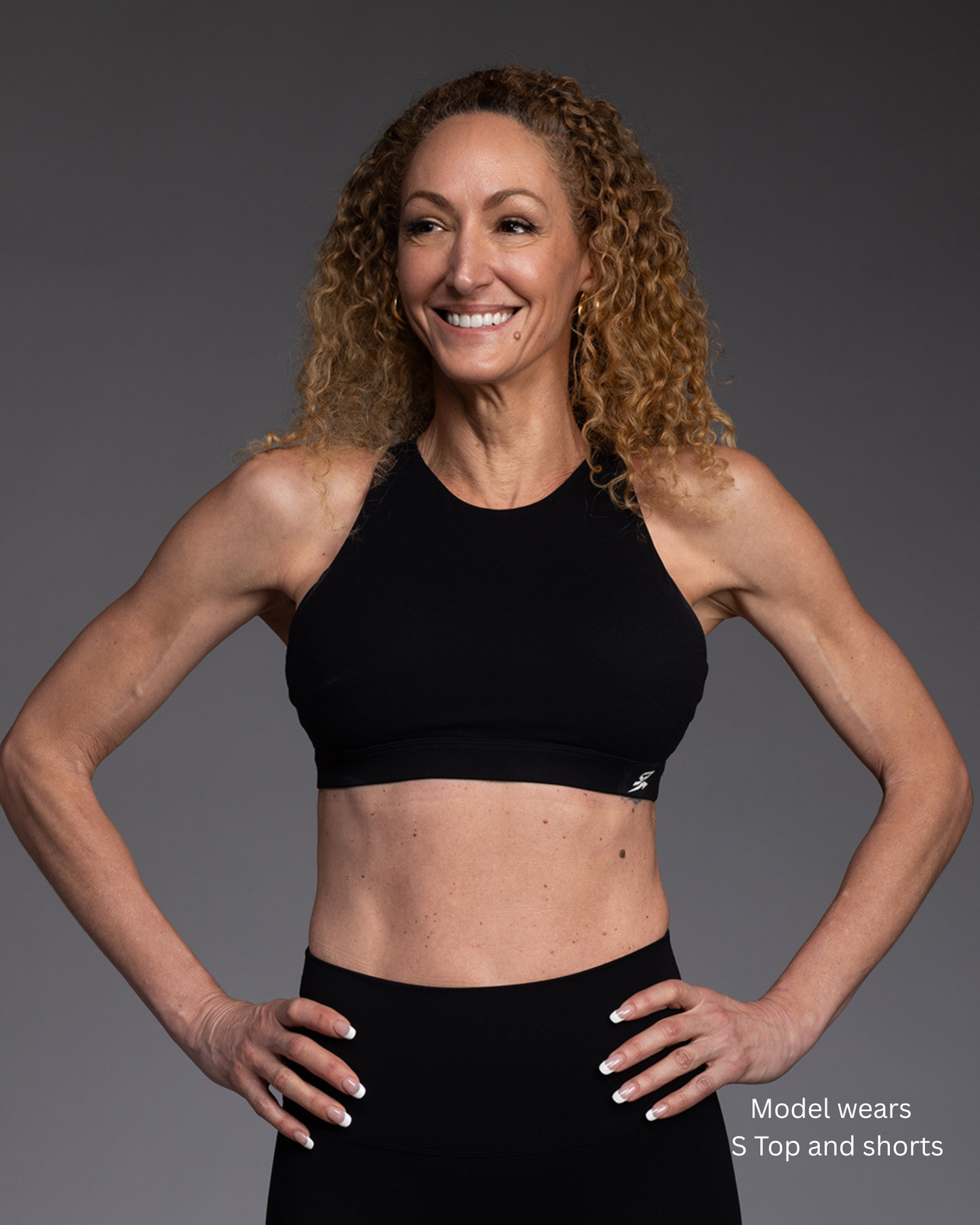 STRYD Performance Serenity cross back sports top in Black — front view. Women's premium gym top Sunshine Coast QLD Australia.