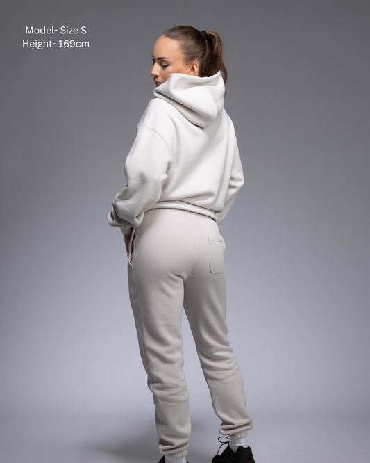 STRYD Performance Elite Womens Track Pant in Bone — back view styled with matching Elite Unisex Hoodie | Premium 320GSM fleece activewear Australia, Sunshine Coast
activewear and gym wear Queensland, fast shipping within 24hrs of order and free shipping when you spend $150 AUD, Tracksuit pants, athleisure winter sets, premium apparel