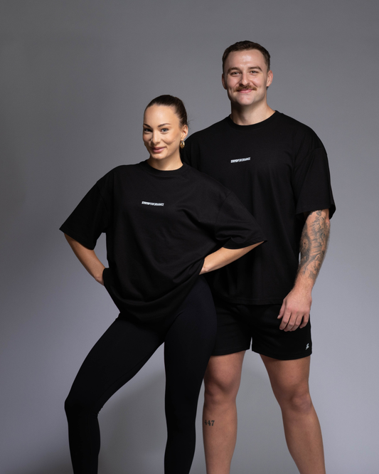 STRYD Performance I Like It Loose Block oversized unisex black tee – relaxed fit gym and street style t-shirt Male and Female Studio shot shop sunshine coast performance activewear and gym fitness apparel