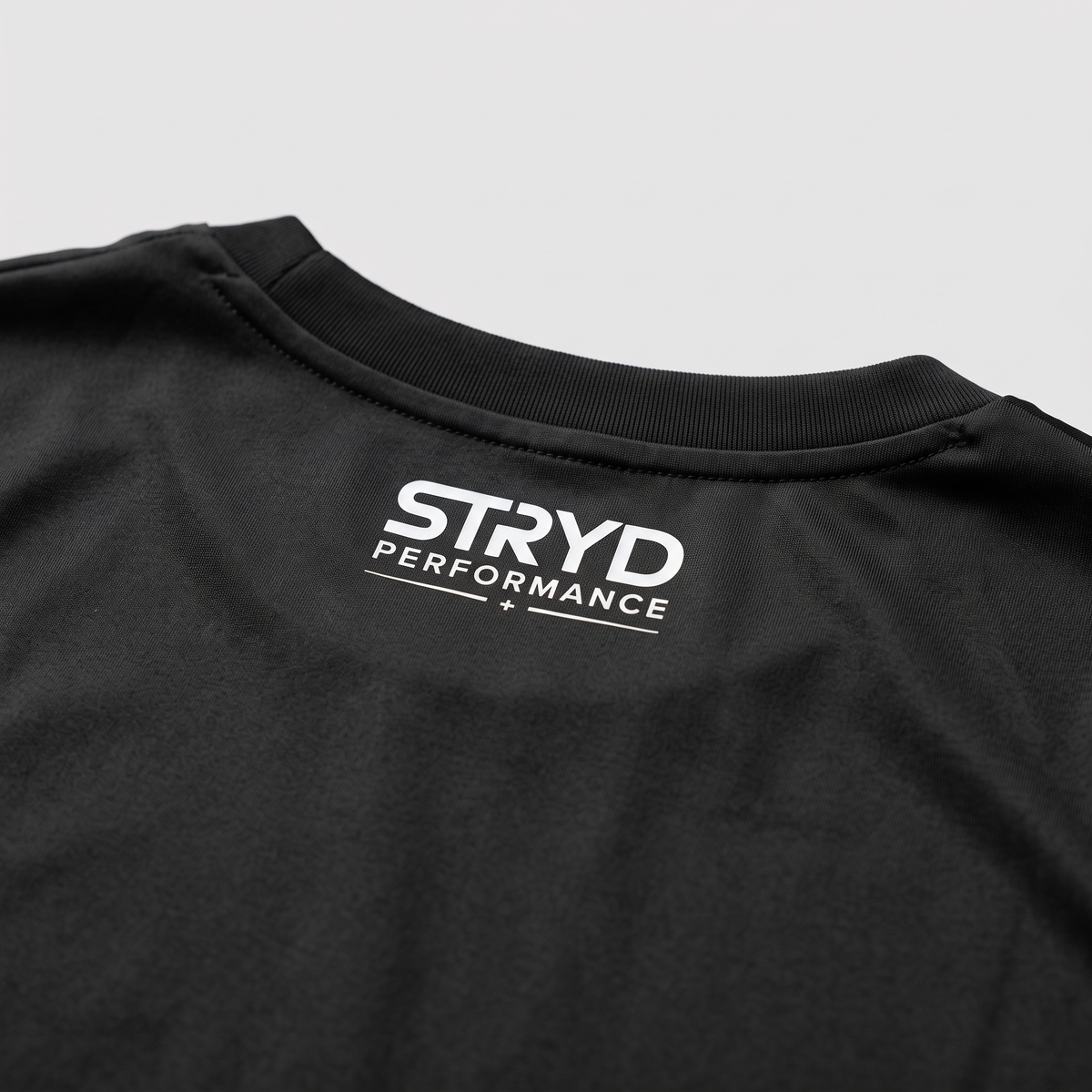 Black back of shirt showing Stryd performance logo I like it fast light weight shirt