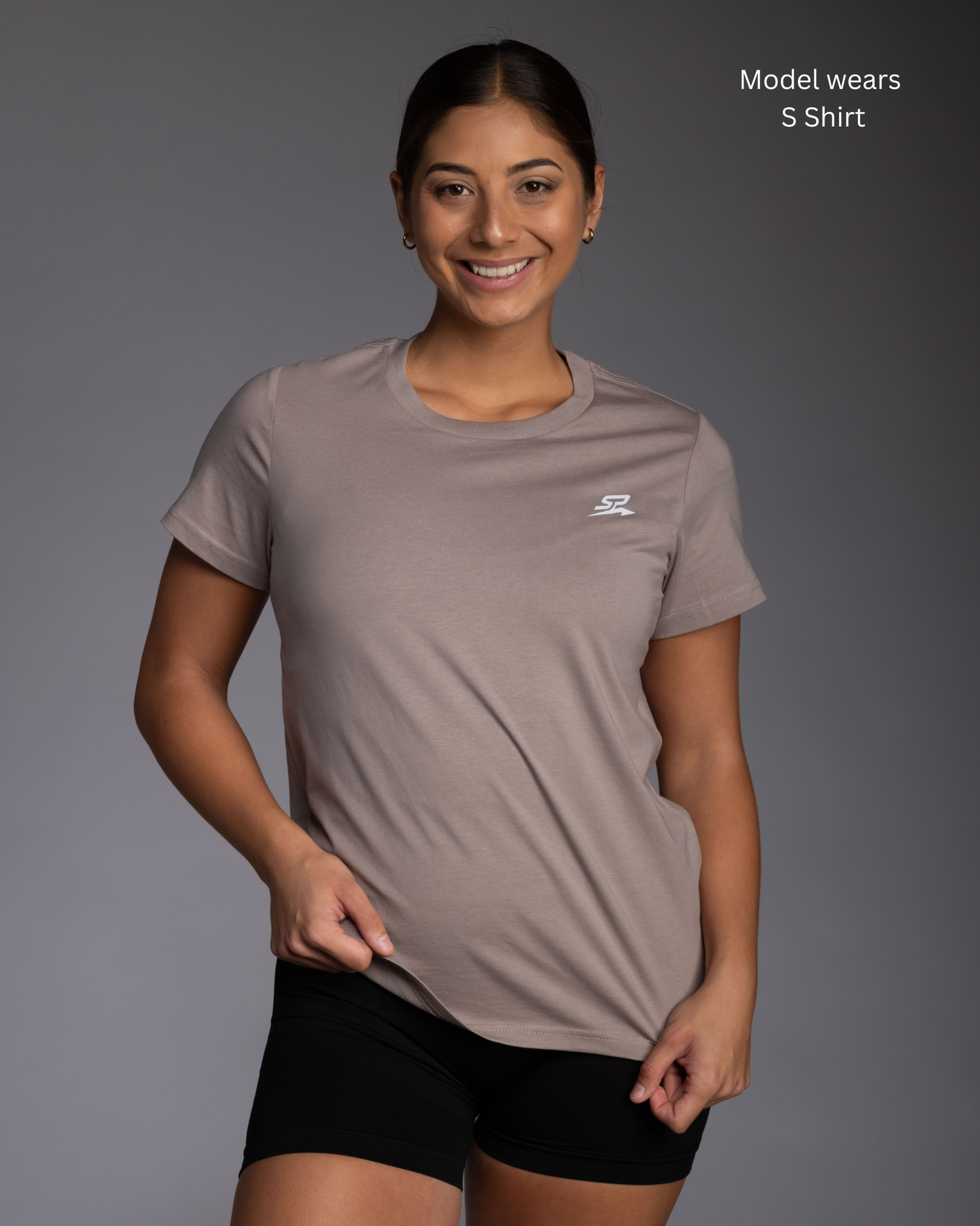 Mushroom regular athletic fit womens gym tee on fitness model standing against a grey wall