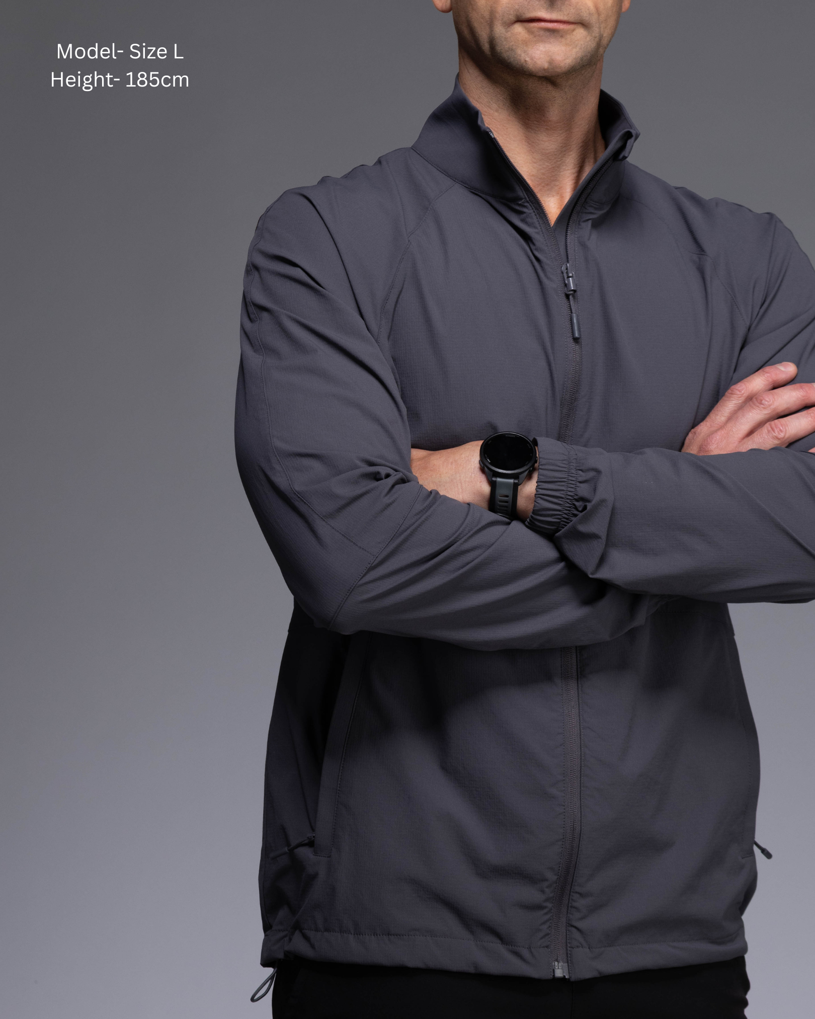 STRYD Performance Axis Tech Jacket – Men's premium gym jacket with athletic close-to-body fit and elastic-bound sleeves male model  front view Slate colour tech jacket Activewear Sunshine Coast
