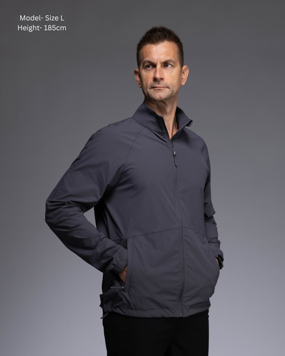 STRYD Performance Axis Tech Jacket – Men's premium gym jacket with athletic close-to-body fit and elastic-bound sleeves male model  side view Slate colour tech jacket Activewear Sunshine Coast