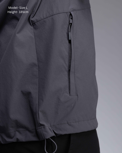 STRYD Performance Axis Tech Jacket – Men's premium gym jacket with athletic close-to-body fit and elastic-bound sleeves male model  detail view Slate colour tech jacket Activewear Sunshine Coast