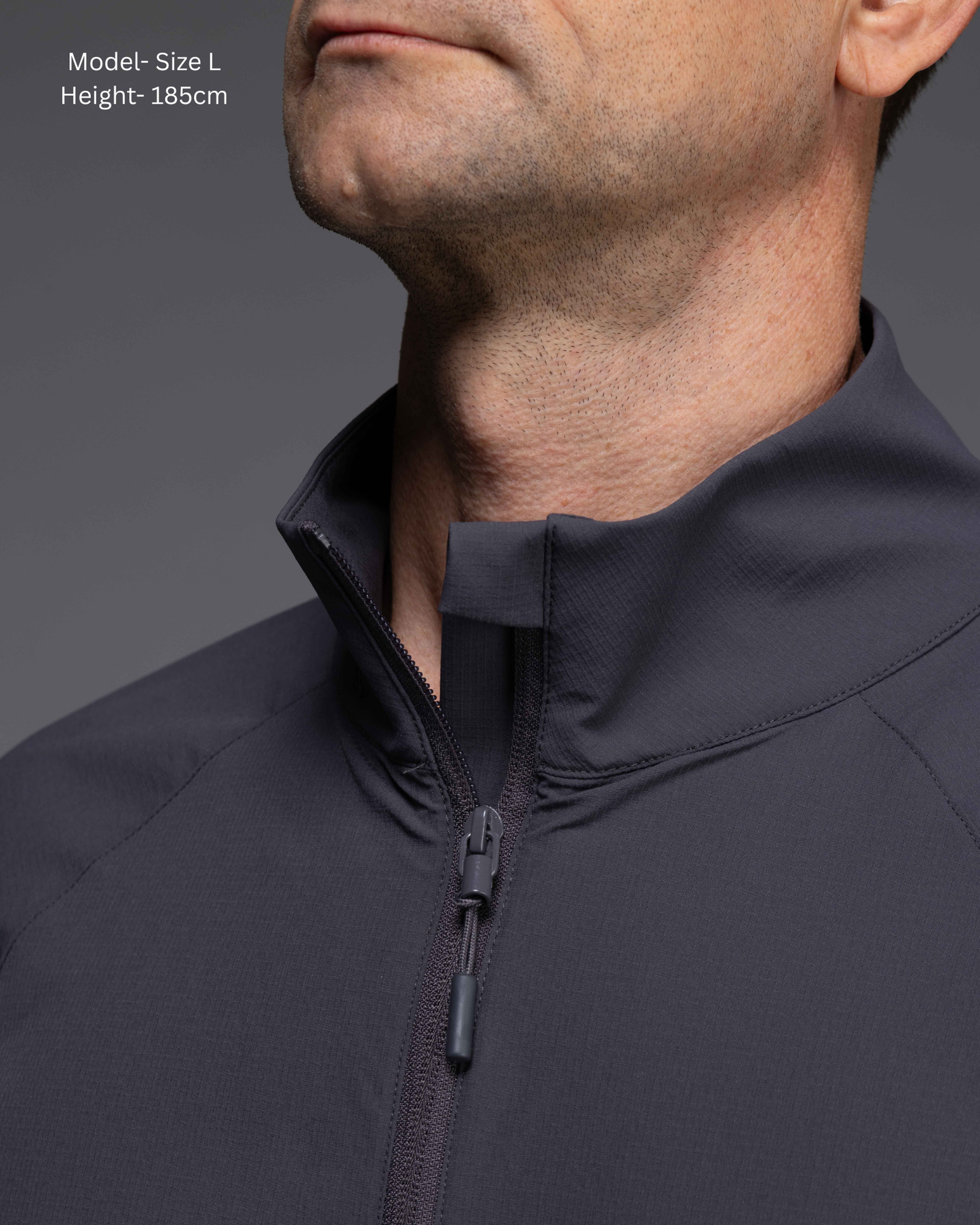 STRYD Performance Axis Tech Jacket – Men's premium gym jacket with athletic close-to-body fit and elastic-bound sleeves male model  close up neck and zip detail view Slate colour tech jacket Activewear Sunshine Coast