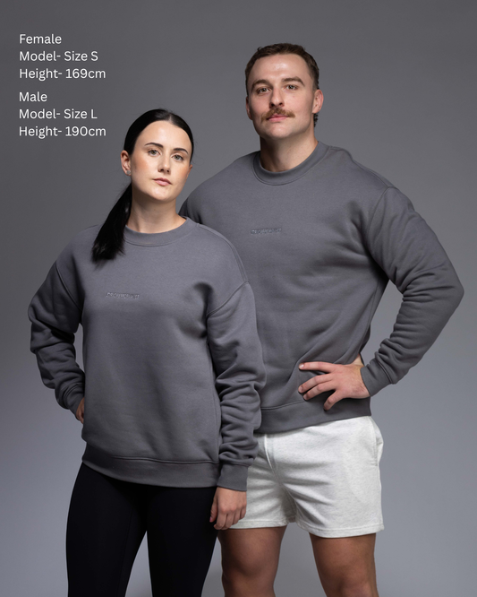 STRYD Performance Elite Unisex Crew in Slate — 320 GSM fleece, relaxed drop-shoulder fit, ribbed cuffs, premium activewear Australia, Sunshine Coast QLD Slate Colour Front view shop now free shipping over $150 male and female model side by side in matching elite Crew Sweaters
