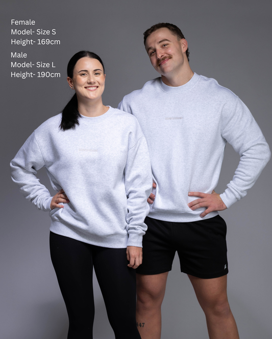 STRYD Performance Elite Unisex Crew Sweater in White Marle — Duo photo of male and female models front view, in matching Elite Crews with relaxed drop-shoulder silhouette | Premium 320GSM fleece gym wear Australia, Sunshine Coast 
activewear and gym wear Queensland, fast shipping within 24hrs of order and free shipping when you spend $150 AUD, Tracksuit pants, athleisure winter sets, premium apparel