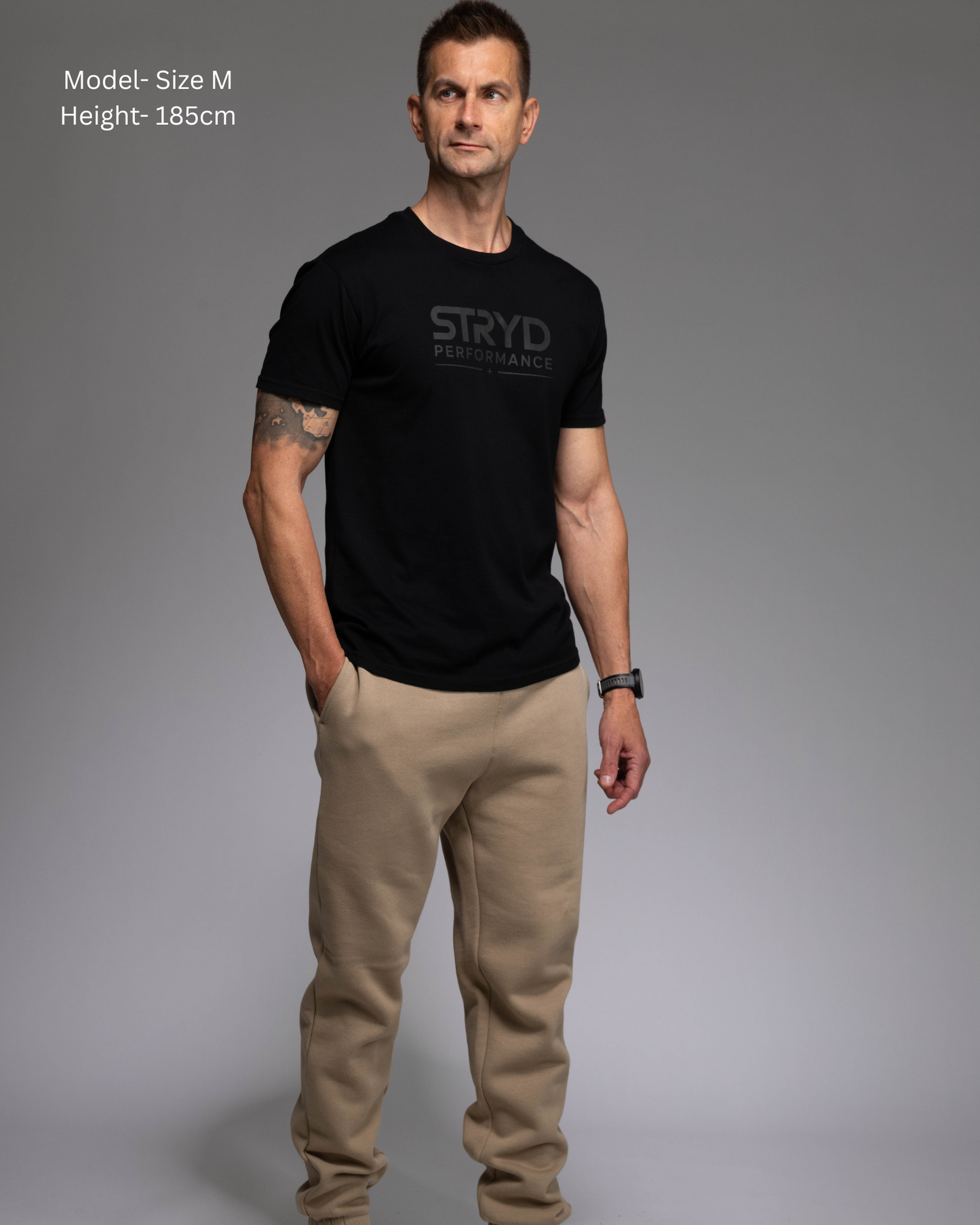 STRYD Performance Elite Unisex Track Pant in Sand — front view on male model, relaxed regular fit, elasticated waistband | Premium 320GSM fleece activewear Australia, Sunshine Coast 
activewear and gym wear Queensland, fast shipping within 24hrs of order and free shipping when you spend $150 AUD, Tracksuit pants, athleisure winter sets, premium apparel