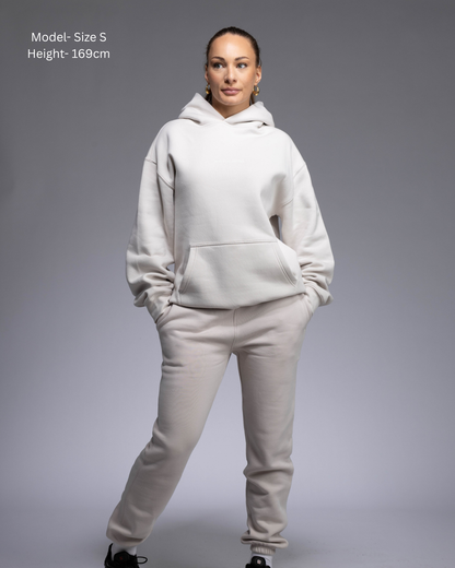 STRYD Performance Elite Womens Track Pant in Bone — front view styled with matching Elite Unisex Hoodie | Premium 320GSM fleece activewear Australia, Sunshine Coast 
activewear and gym wear Queensland, fast shipping within 24hrs of order and free shipping when you spend $150 AUD, Tracksuit pants, athleisure winter sets, premium apparel 