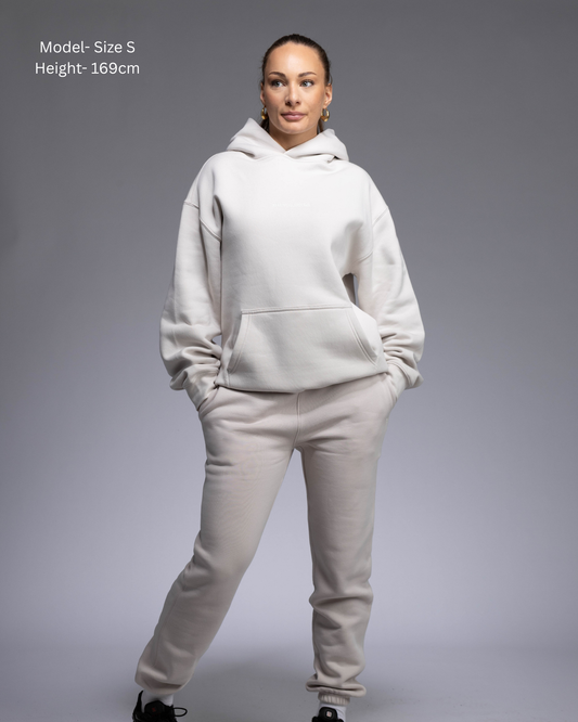 STRYD Performance Elite Womens Track Pant in Bone — front view styled with matching Elite Unisex Hoodie | Premium 320GSM fleece activewear Australia, Sunshine Coast 
activewear and gym wear Queensland, fast shipping within 24hrs of order and free shipping when you spend $150 AUD, Tracksuit pants, athleisure winter sets, premium apparel 