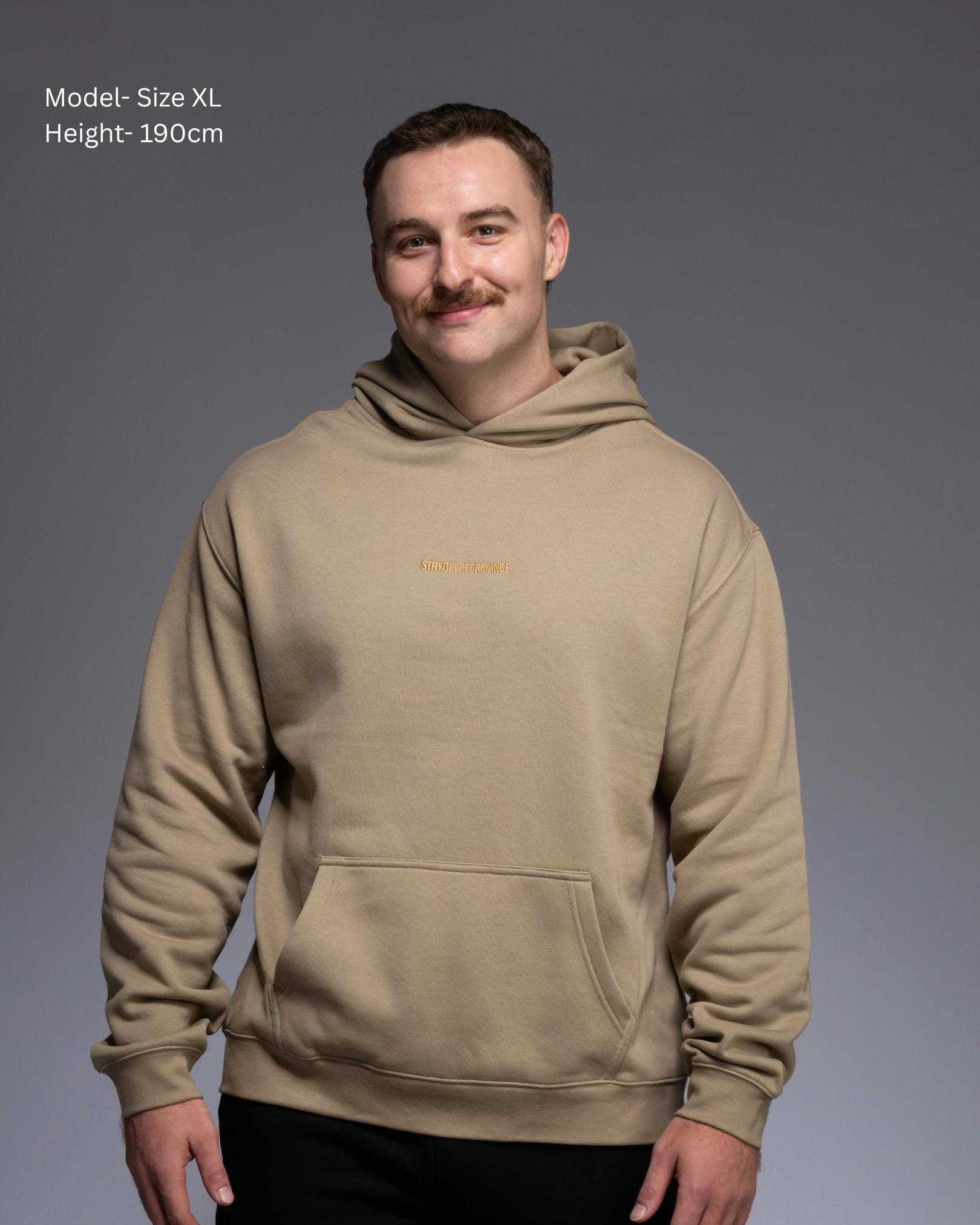 Premium Drop shoulder STRYD Performance Elite Unisex Hoodie in Sand — 320 GSM fleece, relaxed fit, drop-shoulder, ribbed cuffs, premium activewear Australia, Sunshine Coast activewear shop now free shipping over $150 Front View of Elite Hood male Model