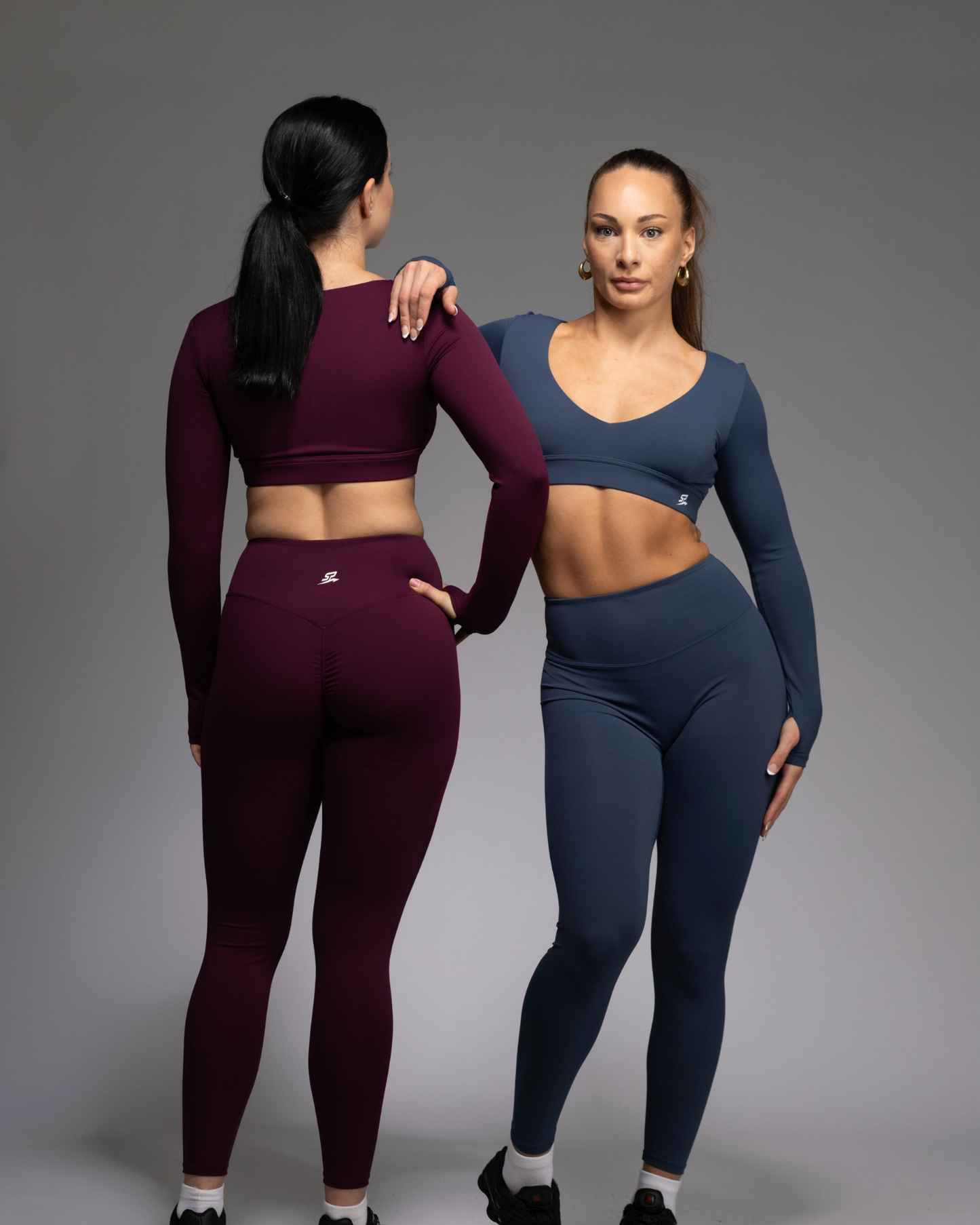 Haven Activewear Collection – women's matching leggings set in Teal and Berry Colours worn by two female fitness models, squat-proof and sleek | STRYD Performance