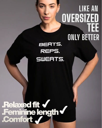 Person wearing a black t-shirt with text on a gray background