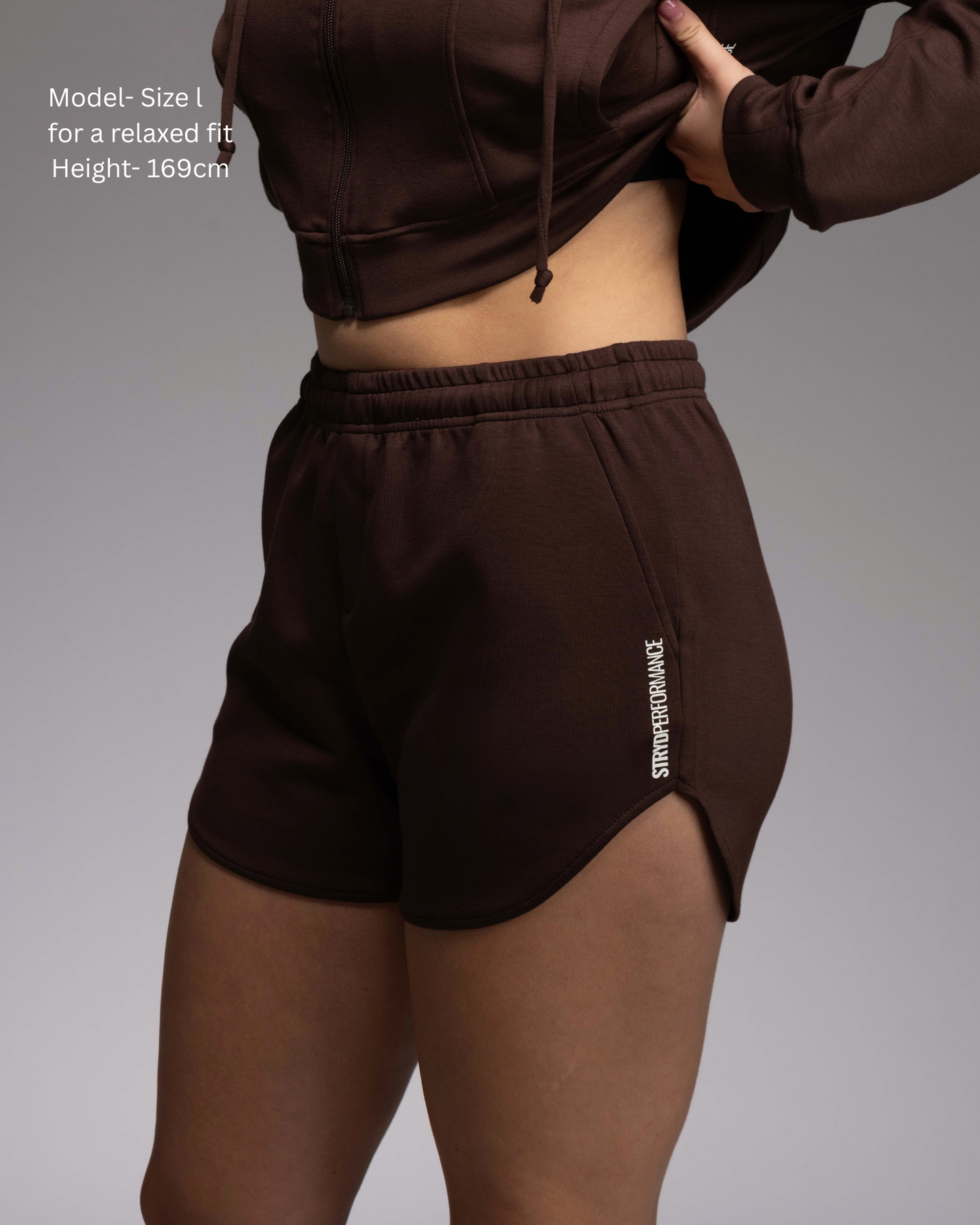 STRYD Performance Soul Soft curved hem shorts — Side view. Women's premium soft activewear and lounge wear shorts Australia. Espresso Colourway, Paired with the Soul Soft Cropped Hoodie