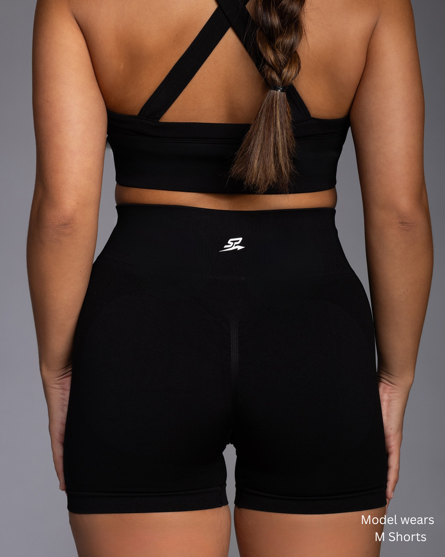 STRYD Performance Vibe training tight shorts in black — back view. Women's training tight shorts Australia.