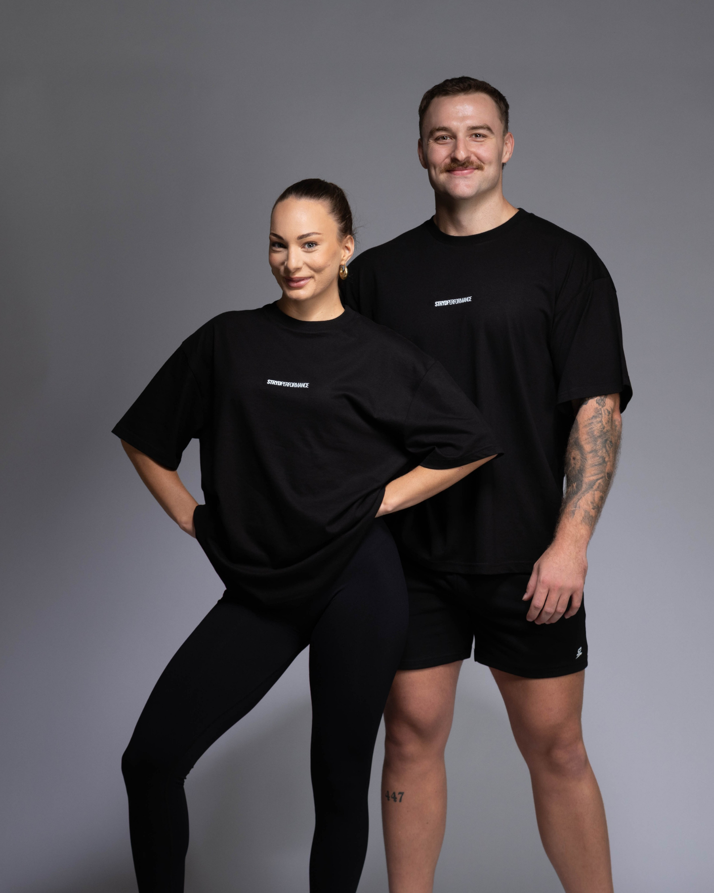 STRYD Performance I Like It Loose Block oversized unisex black tee – relaxed fit gym and street style t-shirt Male and Female Studio shot shop sunshine coast performance activewear and gym fitness apparel