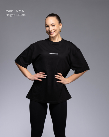 STRYD Performance I Like It Loose Block oversized unisex WHITE tee – Front view relaxed fit gym and street style t-shirt female fitness model in Studio photo. shop sunshine coast performance activewear and gym fitness apparel