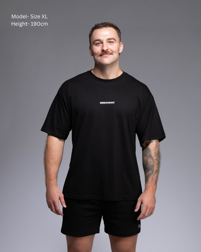 STRYD Performance I Like It Loose Block oversized unisex WHITE tee – Front view relaxed fit gym and street style t-shirt male fitness model in Studio photo. shop sunshine coast performance activewear and gym fitness apparel