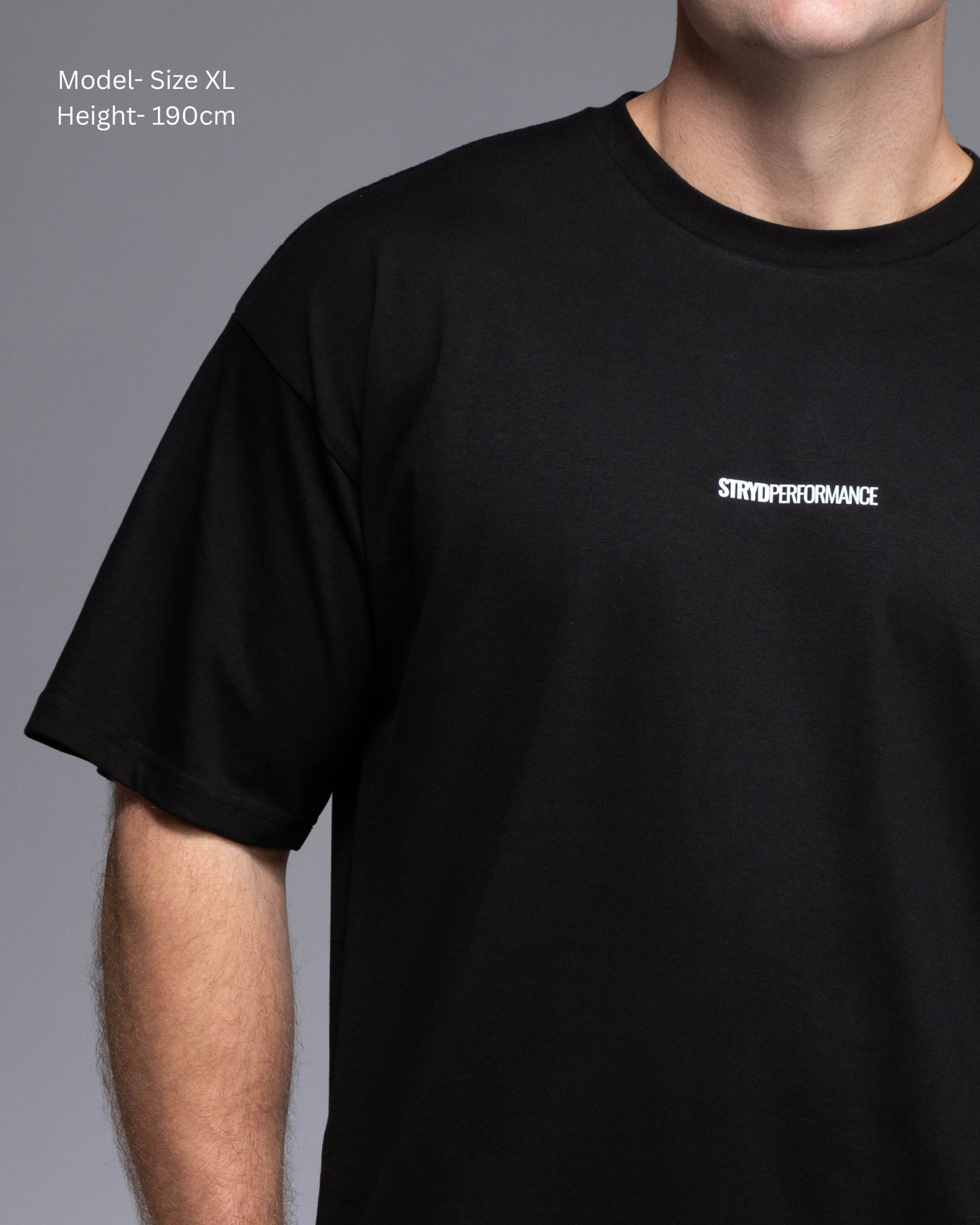 STRYD Performance I Like It Loose Block oversized unisex BLACK tee – Front detail view relaxed fit gym and street style t-shirt male fitness model in Studio photo. shop sunshine coast performance activewear and gym fitness apparel