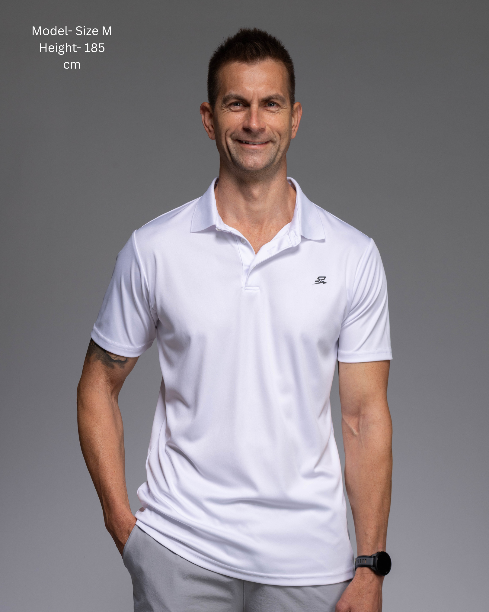 STRYD Performance Tee Off Performance Polo in White — Front view, STRYD Performance logo. Men's premium active tennis polo Australia.
