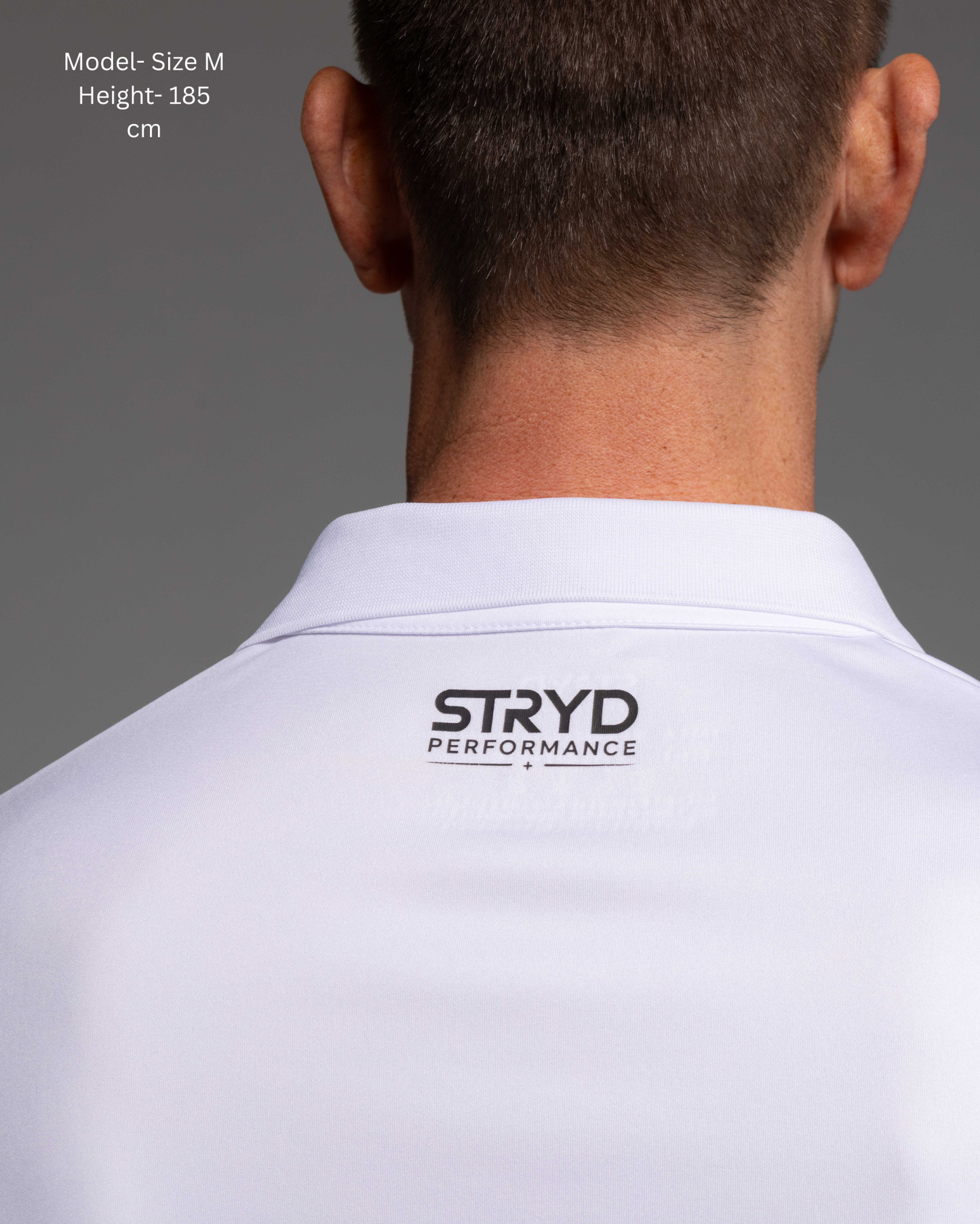 STRYD Performance Tee Off Performance Polo in White — back view, STRYD Performance logo. Men's premium active tennis polo Australia.