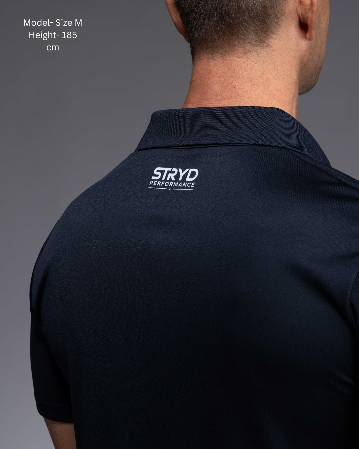 STRYD Performance Tee Off Performance Polo in Deep Navy — back view, STRYD Performance logo. Men's premium active polo Australia.