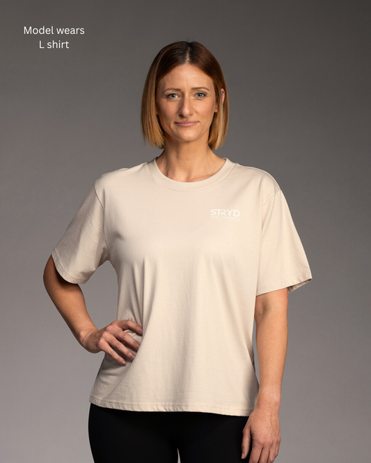 STRYD Performance I Like It Loose Tee in Bone — front view. Women's oversized relaxed fit tee Australia.