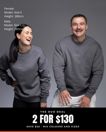 Man and woman in matching Slate Elite crew sweaters. Text: The Duo Deal, 2 for $130, save $26, mix colours and sizes.