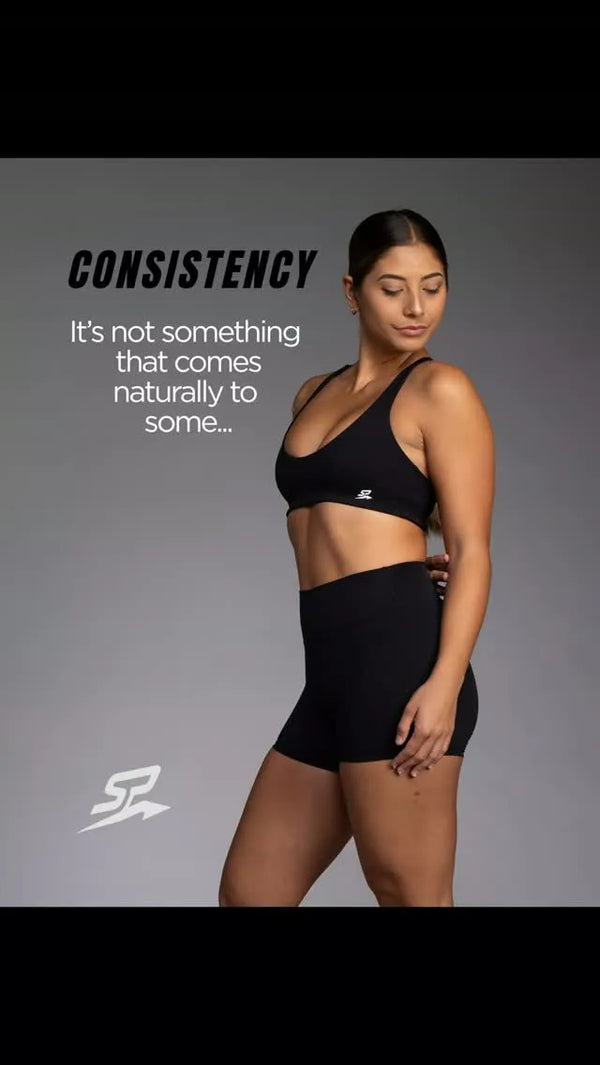 Reel: woman in the black AURA cross-back top and AURA shorts, consistency