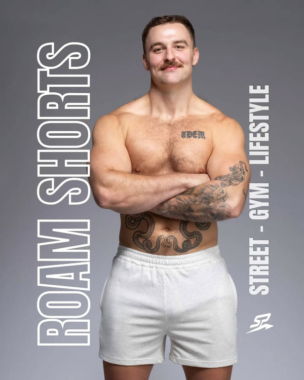 Man wearing the ROAM 5 inch relaxed track shorts in white marle